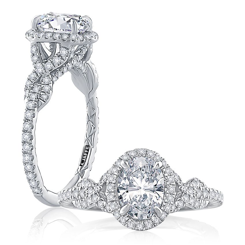 Oval diamond engagement ring with diamond halo and diamond wrap around band