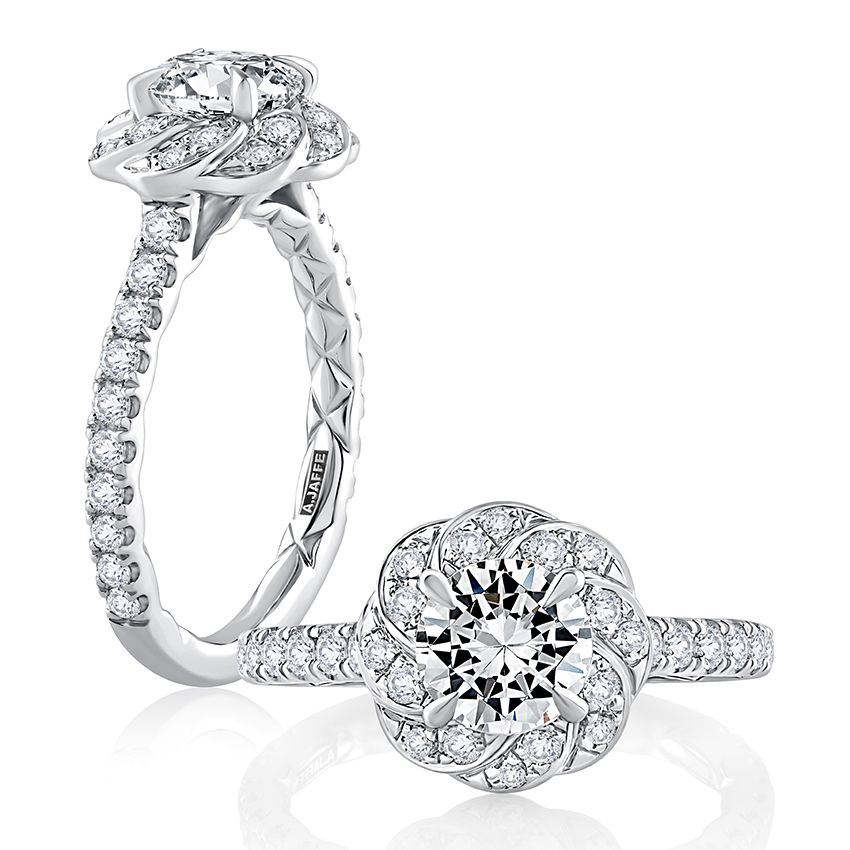 Round diamond center engagement ring with twisted diamond halo and diamonds down shank