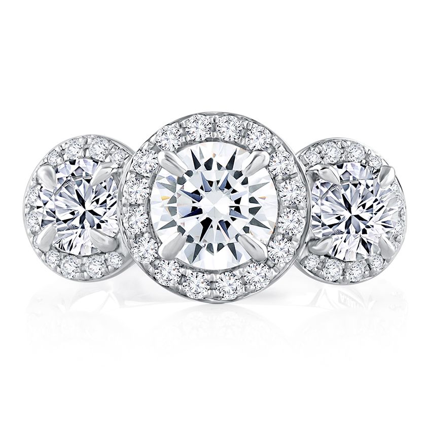 Round diamond three stone ring with diamond halos and diamonds down band